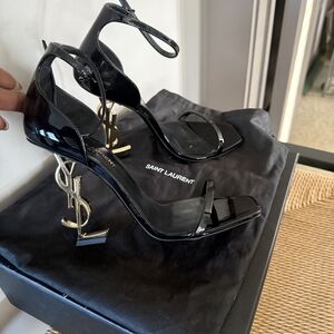 Saint Laurent Glossy Black Heels with Iconic Gold Logo